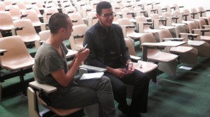 Macias speaks with a student after the discussion.  Photo by: Caitlin Rodriguez
